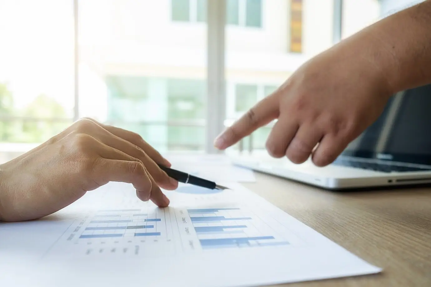 Corporate businessperson working on economy and finance paper.